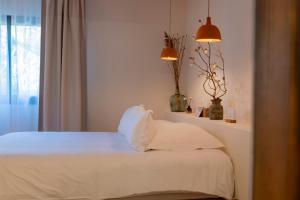 Кровать или кровати в номере VILLA FLAKA Boutique Hôtel Confidentiel et Convivial