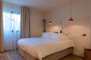 Кровать или кровати в номере VILLA FLAKA Boutique Hôtel Confidentiel et Convivial