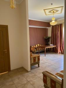 a living room with a couch and a table at Hotel Elita in Odesa