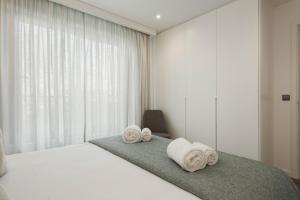 Postel nebo postele na pokoji v ubytování Terracos de Quarteira II Caribe by Real Properties + 23 fotografií