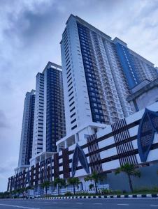 a group of tall buildings in a city at Harina Homestay At Sireh Residence near AEON MALL KOTA BHARU in Kota Bharu