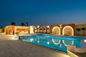 a swimming pool in a hotel at night at Shanghai -Creek -Camping -BBQ -Parent-child- Homestay in Shanghai +25 photos