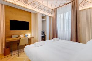TV a/nebo společenská místnost v ubytování QC room Milano Porta Romana