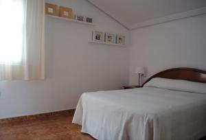 Ένα ή περισσότερα κρεβάτια σε δωμάτιο στο Casa Aqua