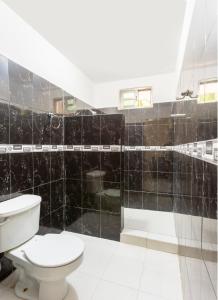 Koupelna v ubytování OYO Hotel Rio