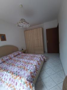 Postel nebo postele na pokoji v ubytování Simone 2C + 3 fotografie