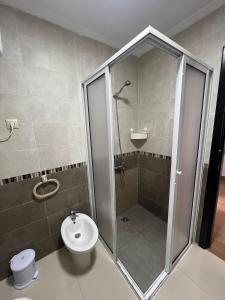 a bathroom with a shower and a toilet at Equipped studio in Tetouan in Tétouan +2 photos