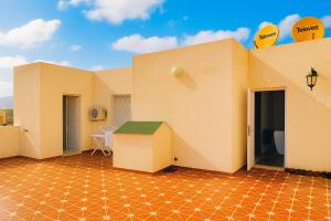 a room with orange tiled floors and a building with balloons at Equipped studio in Tetouan in Tétouan