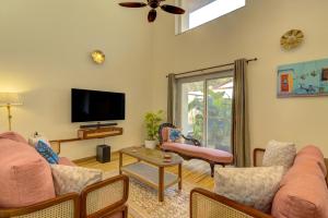 a living room with a couch and a tv at Casa Avasa - 3bhk Private Pool Villa in Siolim in Camorlim