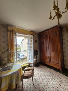 a dining room with a table and a window at Le relais de campagne à 5 min de Padirac in Miers +14 photos