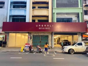 a group of people standing in front of a building at Urbanli Hatyai Hotel in Hat Yai +46 photos