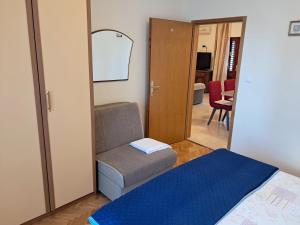 Postel nebo postele na pokoji v ubytování Apartments Melinda