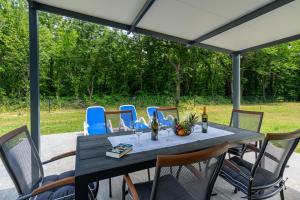 a table and chairs on a patio at Villa DE Luna Istra,whirlpool in Barban