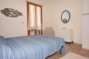 Ένα ή περισσότερα κρεβάτια σε δωμάτιο στο Appartamento Trilocale Acquazzurra