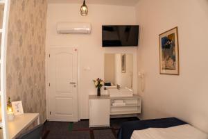 Postel nebo postele na pokoji v ubytování BlueBell Hotel