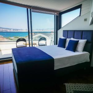 Ένα ή περισσότερα κρεβάτια σε δωμάτιο στο Palm Villa Büyükada
