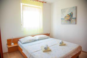 Ένα ή περισσότερα κρεβάτια σε δωμάτιο στο Apartments Mirakul