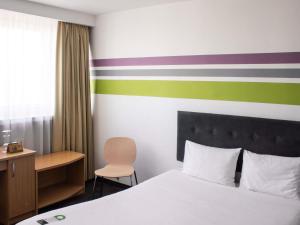 Postel nebo postele na pokoji v ubytování ibis Styles Bielsko Biala