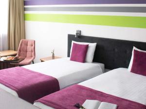 Postel nebo postele na pokoji v ubytování ibis Styles Bielsko Biala