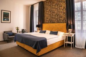 Postel nebo postele na pokoji v ubytování BlueBell Hotel