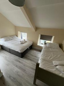 Postel nebo postele na pokoji v ubytování York Comfort Inn