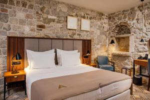 Armerun Heritage Hotel & Residences客房内的一张或多张床位