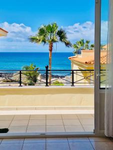 a balcony with a view of the ocean at Villa Sol Los Cristianos in Los Cristianos