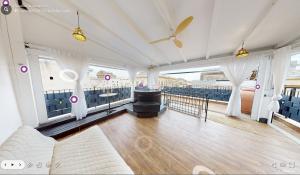 a living room with a couch and a balcony at Teatro Massimo Terrace relax suite in Palermo