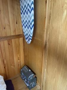 a corner of a room with a bed and a suitcase at Camaraderie Guest House in York