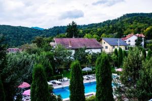 an aerial view of a resort with a swimming pool at Grand Hotel in Braşov