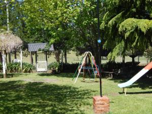 a playground in a yard with a slide at Piedra Caliza in Tandil