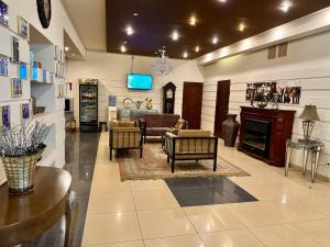 a living room filled with furniture and a tv at Hotel Nika in Chornomorsk