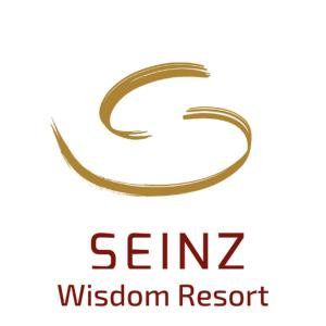 a gold szz logo with the words szz wisdom resort at SEINZ Wisdom Resort - Bio-Hotel vegan-vegetarisch in Bad Kohlgrub +130 photos