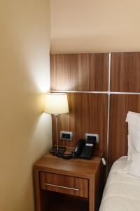 Rúm í herbergi á Bella Vista Hotel - Encarnación