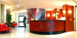 a lobby with a fountain in the middle of a building at Hotel Duca Degli Abruzzi in Montesilvano