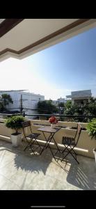 a patio with a table and chairs on a balcony at Hotel Ngọc My in Phan Thiet