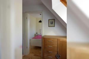 Ein Bett oder Betten in einem Zimmer der Unterkunft Kamminke - Uns lütt Hus