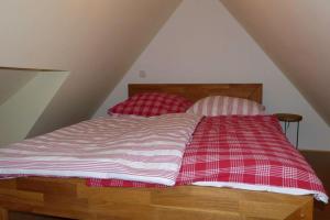 Ein Bett oder Betten in einem Zimmer der Unterkunft Kamminke - Uns lütt Hus