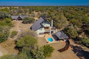 an aerial view of a house with a yard at Stunning Bushveld Villa 84 in Warmbaths