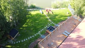an overhead view of a yard with a wooden deck at Mazury Lake View in Rusek Wielki