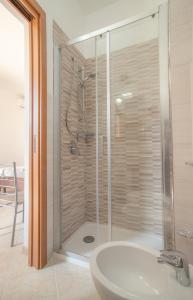 a bathroom with a shower and a sink at Dammuso Ignazio in Lampedusa