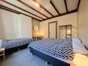 Gîte de Groupe de la Semoisにあるベッド