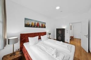 Postel nebo postele na pokoji v ubytování Vaicun Stays LUXURY APARTMENTS - Stilvolle Apartments am Tegernsee