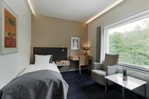 Postel nebo postele na pokoji v ubytování Frederiksdal Sinatur Hotel & Konference + 33 fotografií