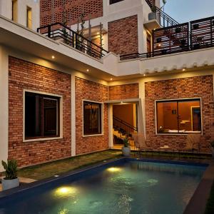 a swimming pool in the backyard of a house at Villa with Private Pool, 12 mins walk to Beach in Trincomalee