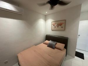 Ένα ή περισσότερα κρεβάτια σε δωμάτιο στο A&S Homestay at Metrocity Condominium