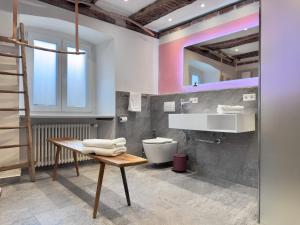 a bathroom with a sink and a toilet at Villa Schloss Rimsingen Fine Apartments in Breisach am Rhein +39 photos