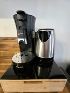 a coffee maker sitting on top of a counter at Love Room Luxe and Spa - Sauna in Domérat