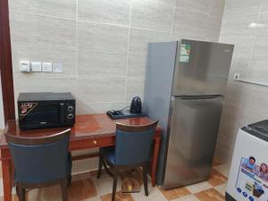 Kuchyň nebo kuchyňský kout v ubytování Eqamh Etlala Quba- إقامة إطلالة قباء + 29 fotografií