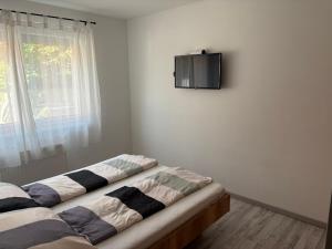 Posteľ alebo postele v izbe v ubytovaní Kohl Wellness Apartman